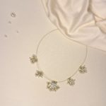 Invisible chain with white stones